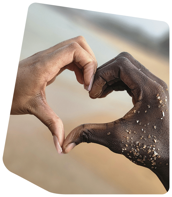 couple forming a heart using their hands