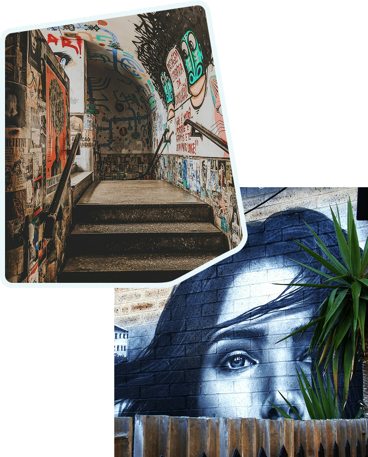 stairs with paintings on the wall